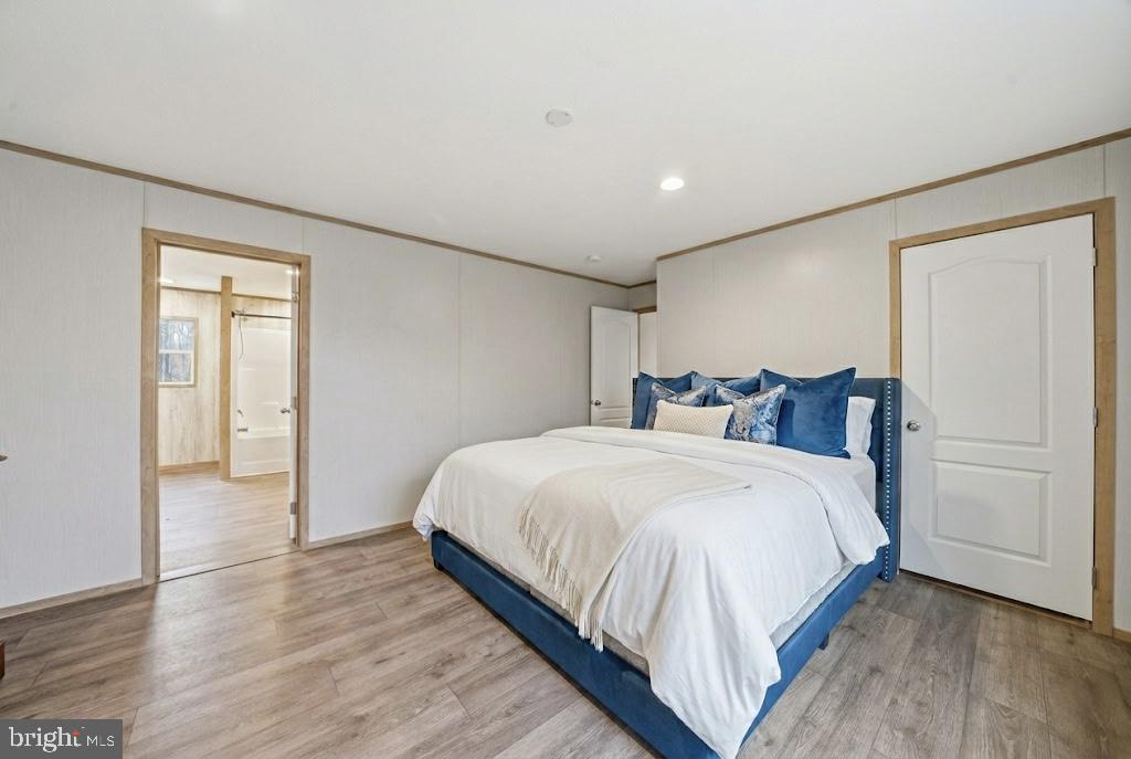 15075 Madison Run Road Gordonsville, VA 22942 - Photo 14 of 23 a bedroom with bed and cabinets