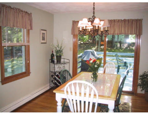 2 Virginia Road Waltham, MA 02453 - Photo 5 of 8 a view of a dining room with furniture wooden floor and a chandelier