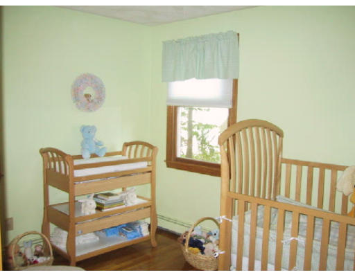 2 Virginia Road Waltham, MA 02453 - Photo 8 of 8 a bedroom with a bed and a window