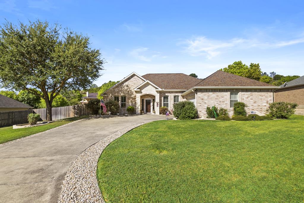 1809 Mount Laurel Trail Kerrville, TX 78028 - Photo 1 of 1 a front view of a house with a yard