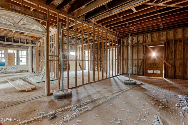 a view of a hall with wooden floor