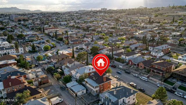 an aerial view of residential house with outdoor space and tree