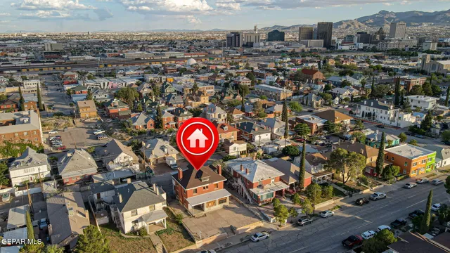 an aerial view of a street with parking space