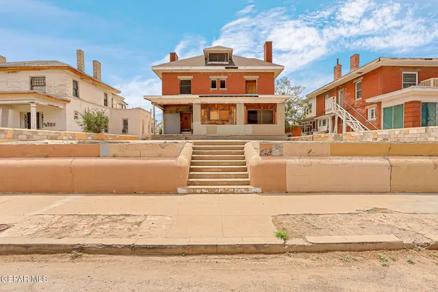 a front view of a house with a ocean view