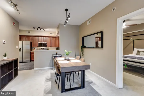 a open kitchen with a table and chairs in it