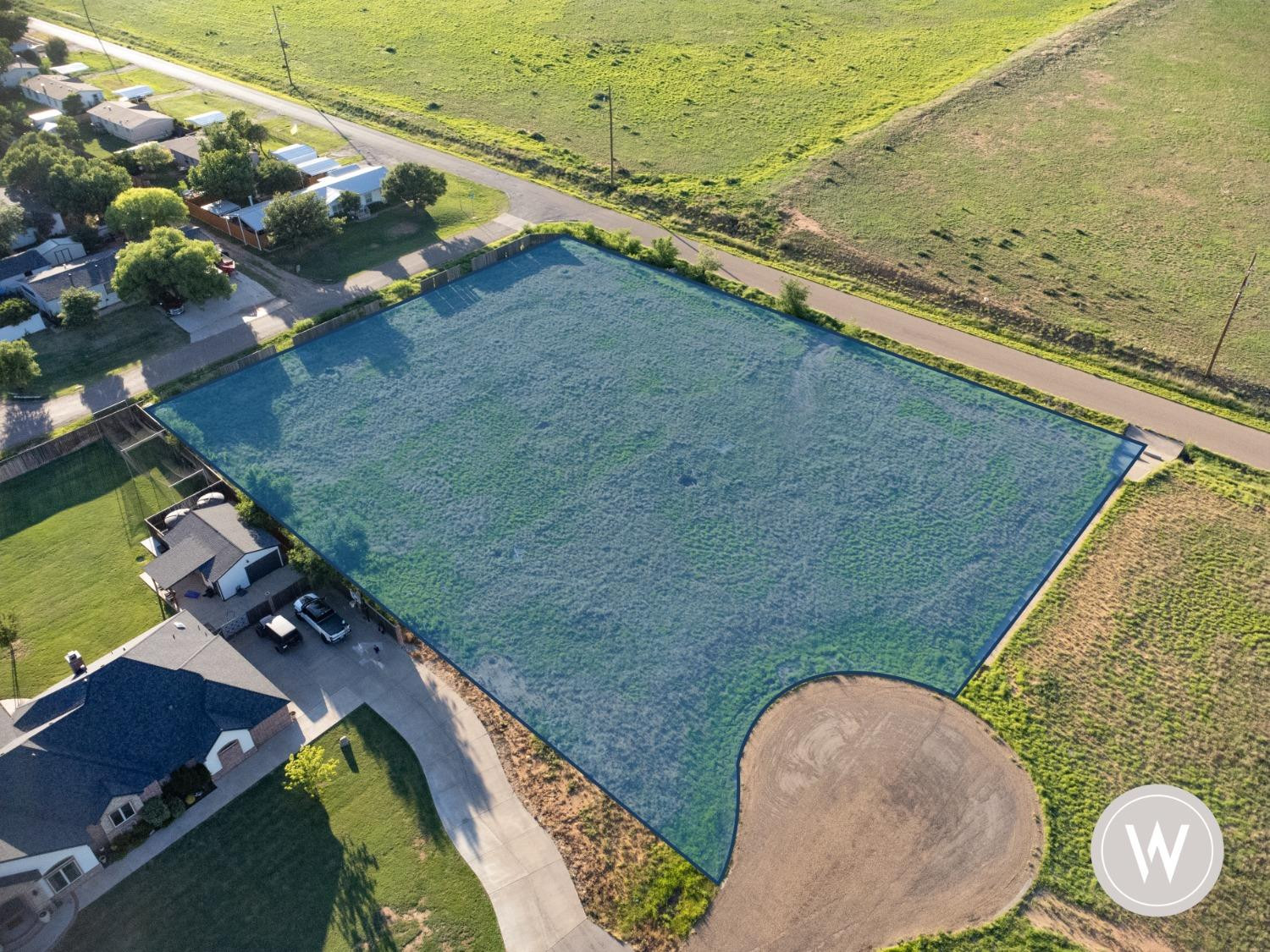 a view of a swimming pool with a yard
