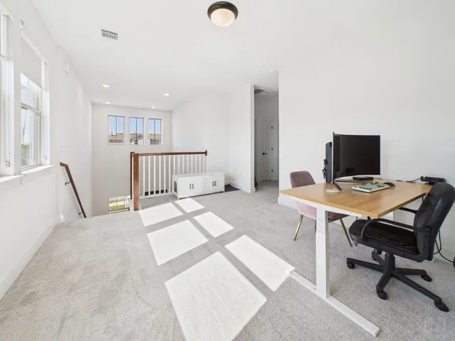 a view of a workspace with furniture