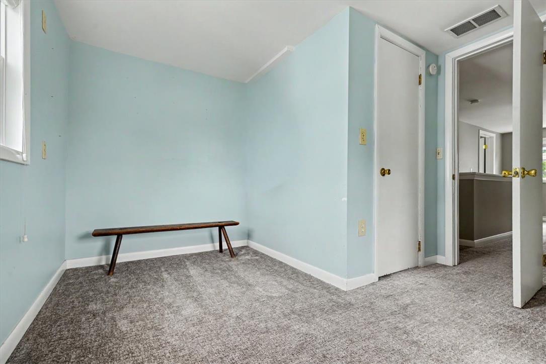 303 Cedar Road Hellertown, PA 18055 - Photo 20 of 27 A versatile interior space featuring durable carpet and crisp white trim.