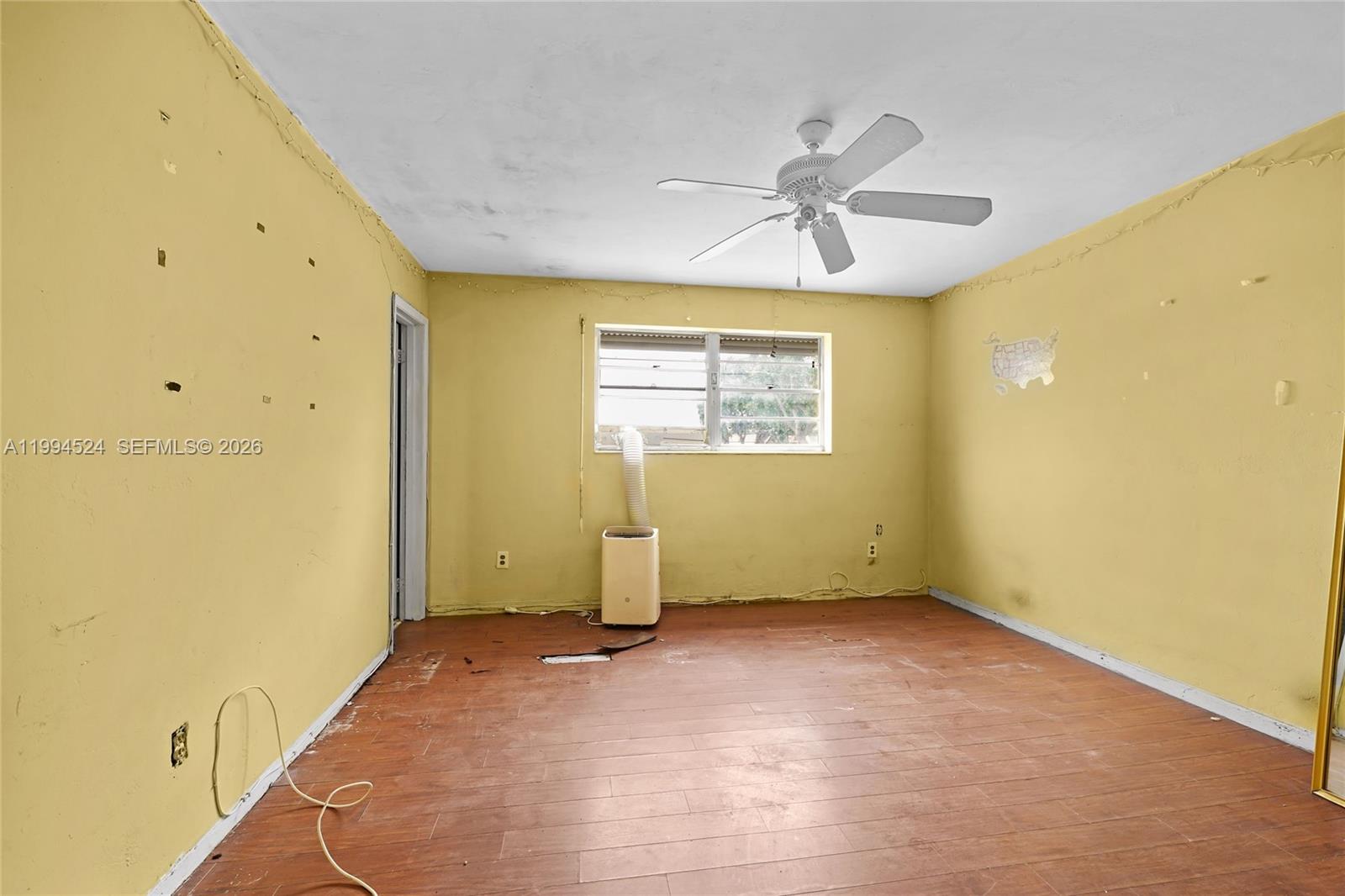 7205 West 2nd Lane Hialeah, FL 33014 - Photo 19 of 30 a view of an empty room with a window