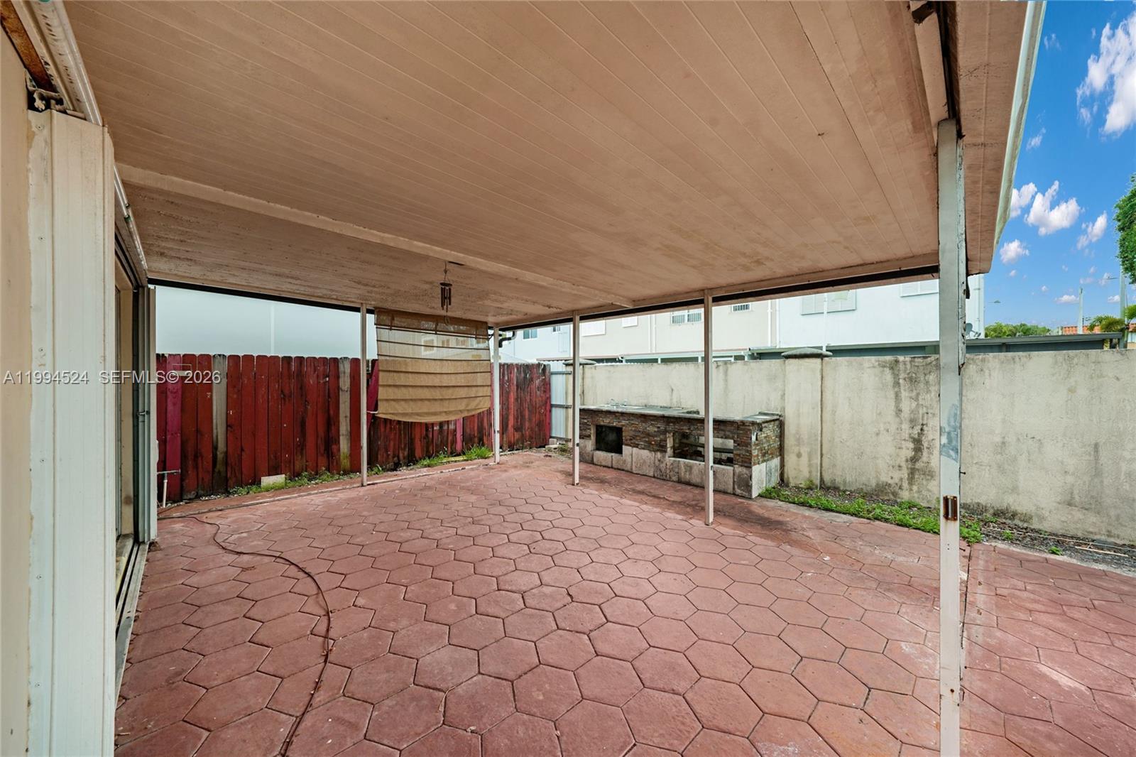 7205 West 2nd Lane Hialeah, FL 33014 - Photo 25 of 30 a view of a patio with table and chairs