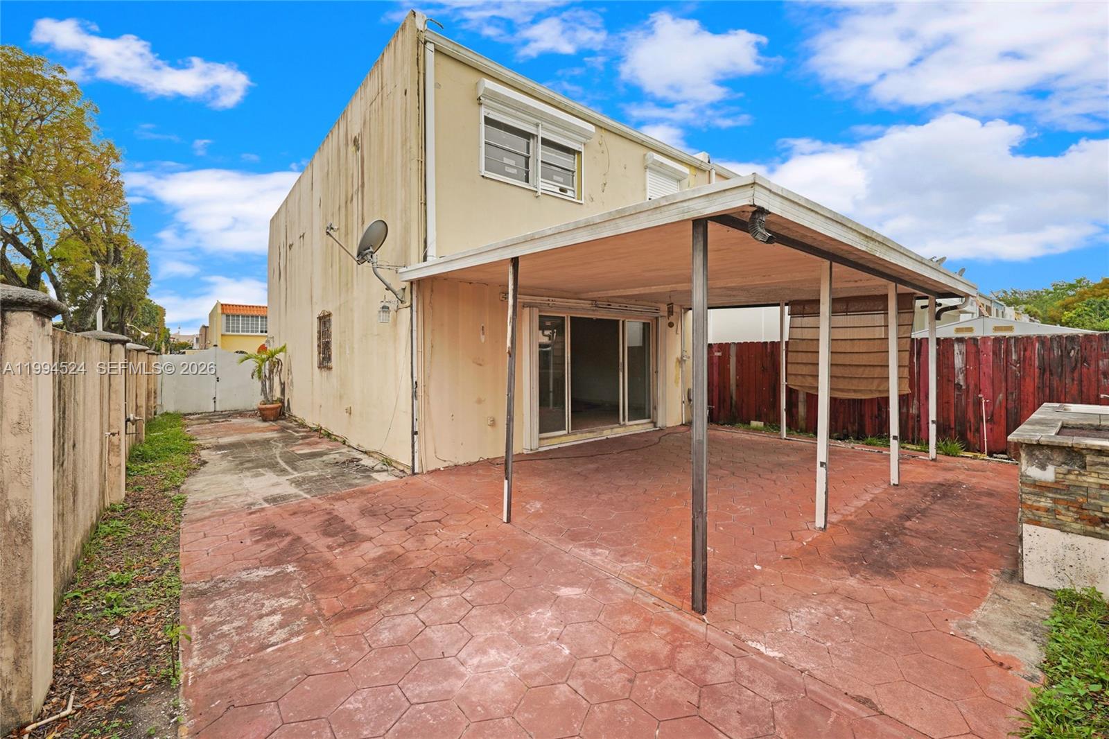 7205 West 2nd Lane Hialeah, FL 33014 - Photo 29 of 30 a view of a house with backyard and porch
