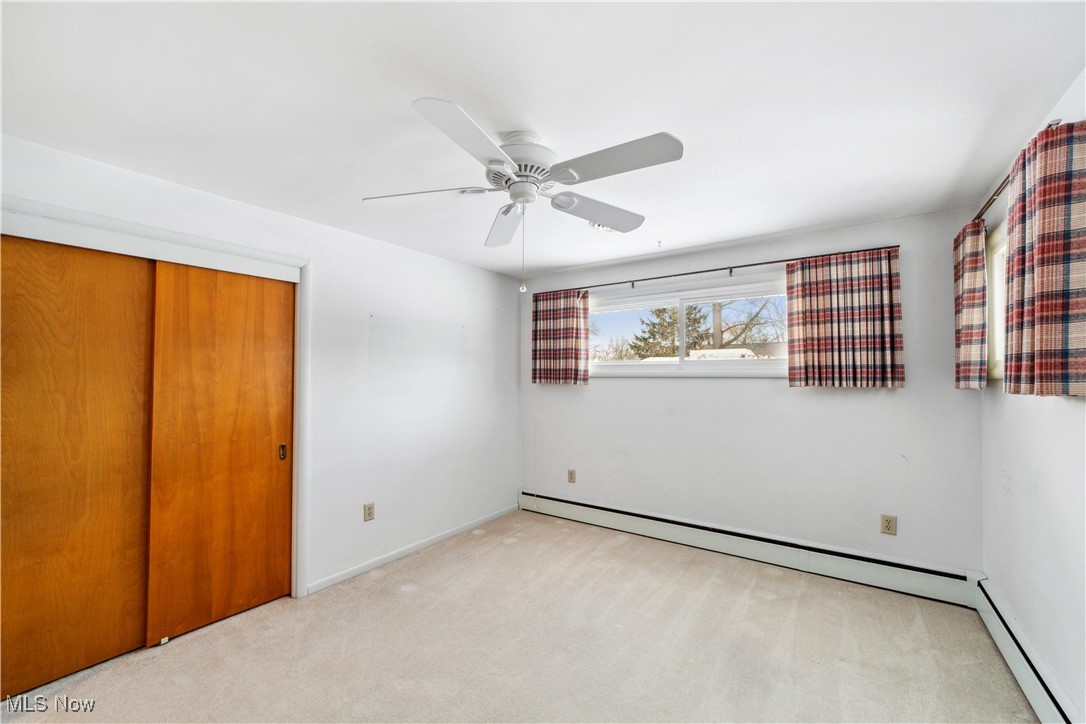 230 Fairfield Road Avon Lake, OH 44012 - Photo 18 of 40 Unfurnished bedroom with ceiling fan, a closet and light carpet