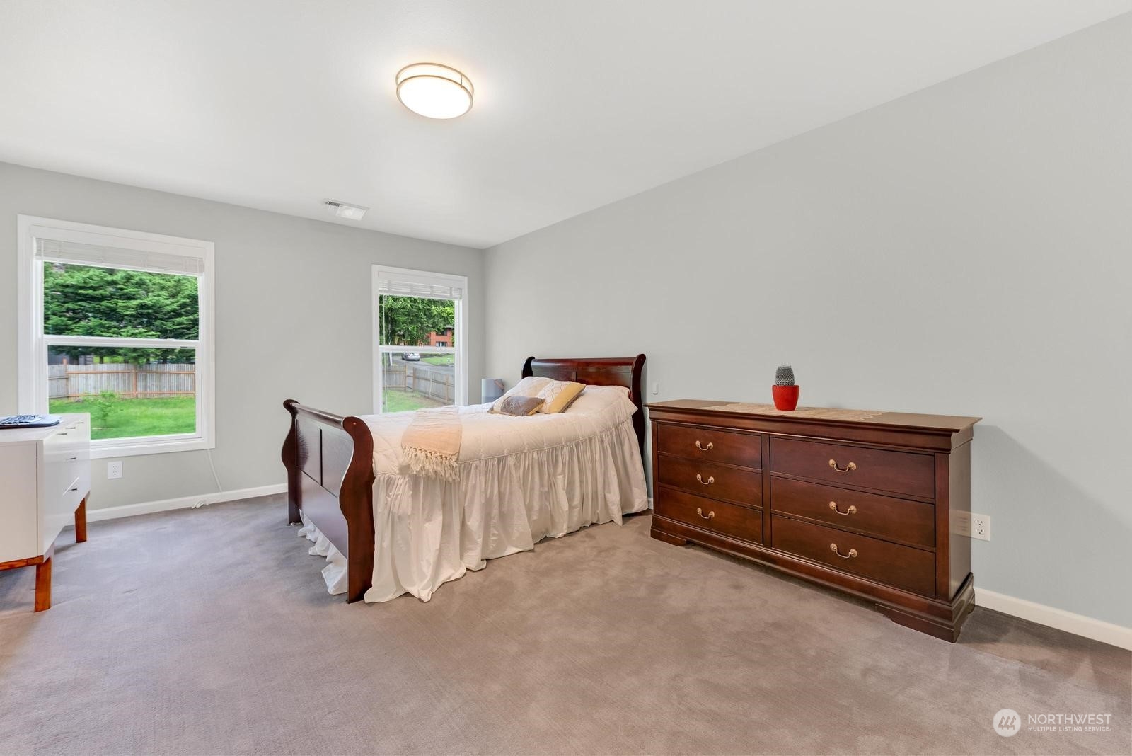 17218 3rd Avenue Southeast Bothell, WA 98012 - Photo 16 of 28 a bedroom with a bed and a printing on the wall