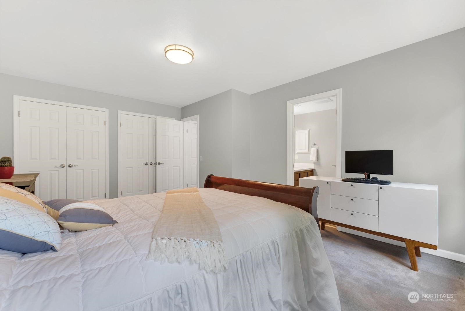 17218 3rd Avenue Southeast Bothell, WA 98012 - Photo 17 of 28 a bedroom with a bed and a flat screen tv
