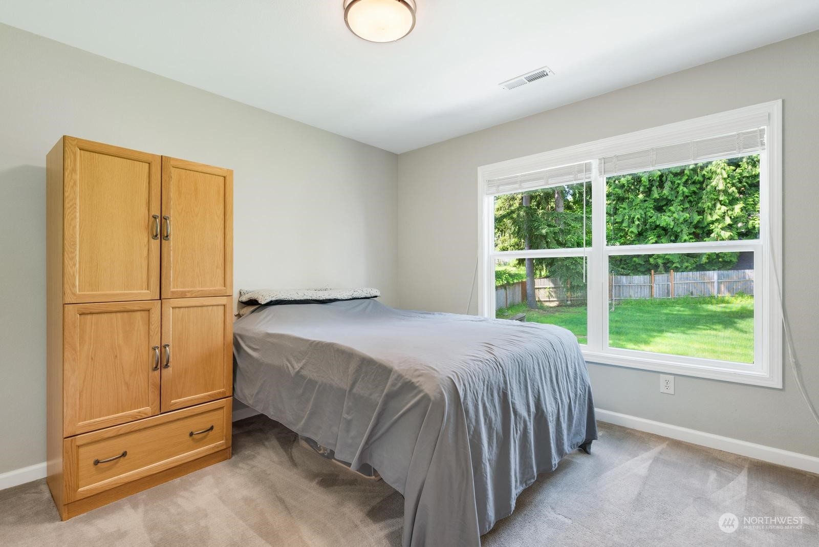 17218 3rd Avenue Southeast Bothell, WA 98012 - Photo 20 of 28 a bedroom with a bed and a window
