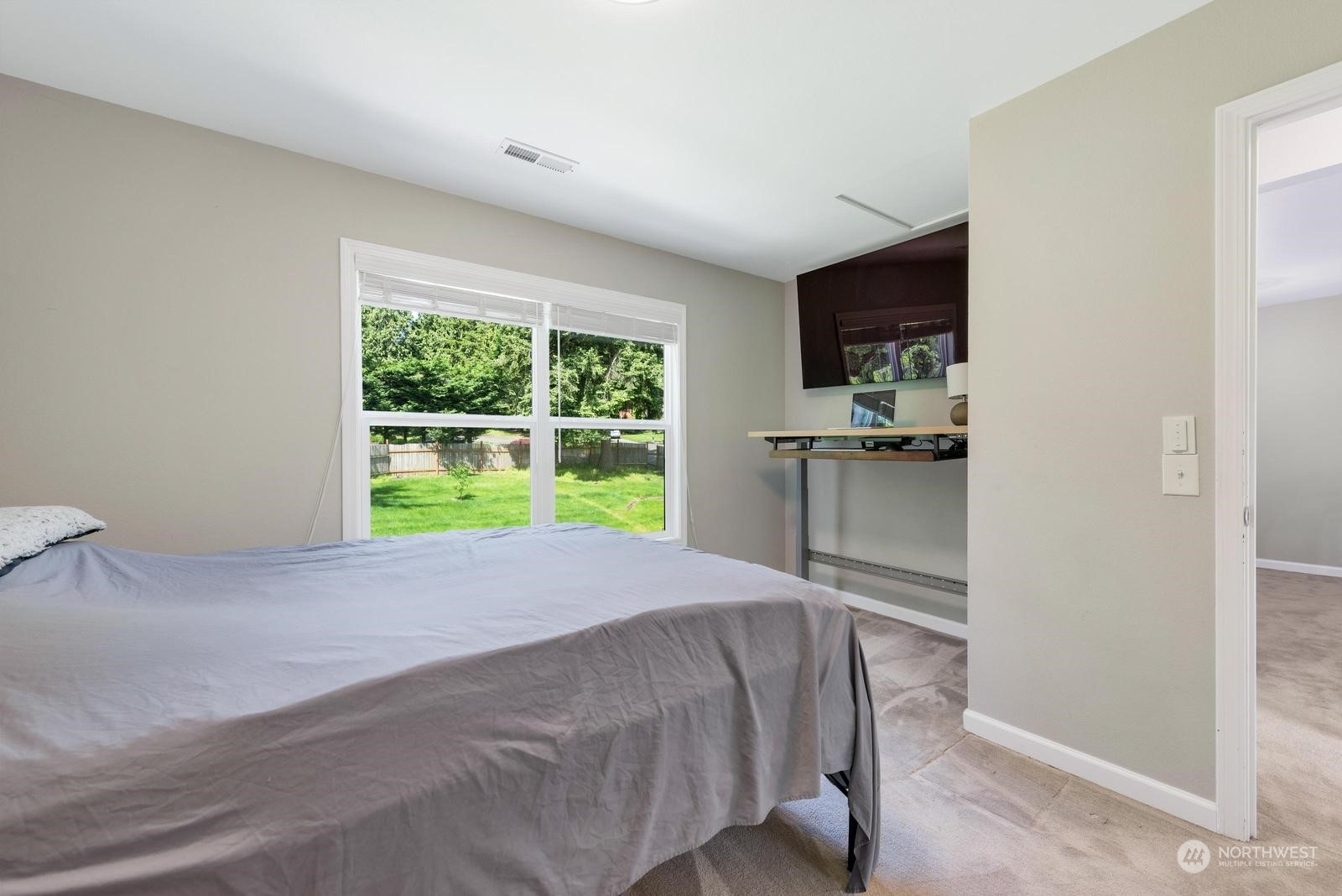 17218 3rd Avenue Southeast Bothell, WA 98012 - Photo 21 of 28 a room with a bed and a television