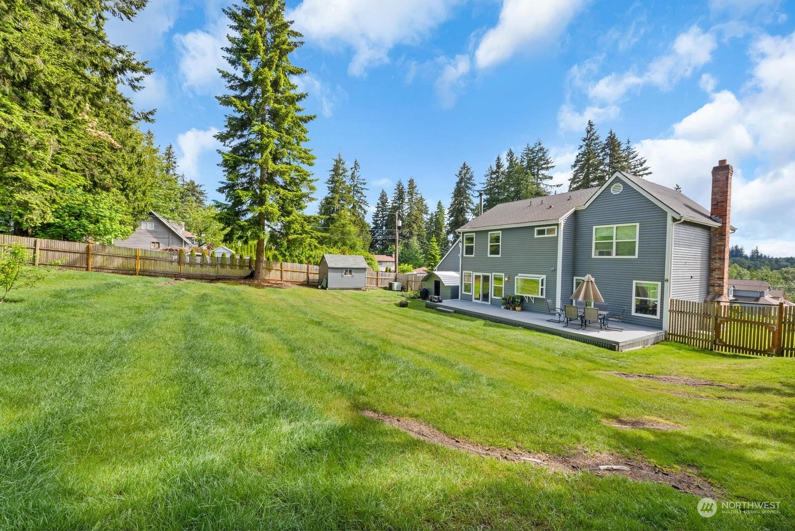 17218 3rd Avenue Southeast Bothell, WA 98012 - Photo 25 of 28 a view of a house with a big yard potted plants and large tree