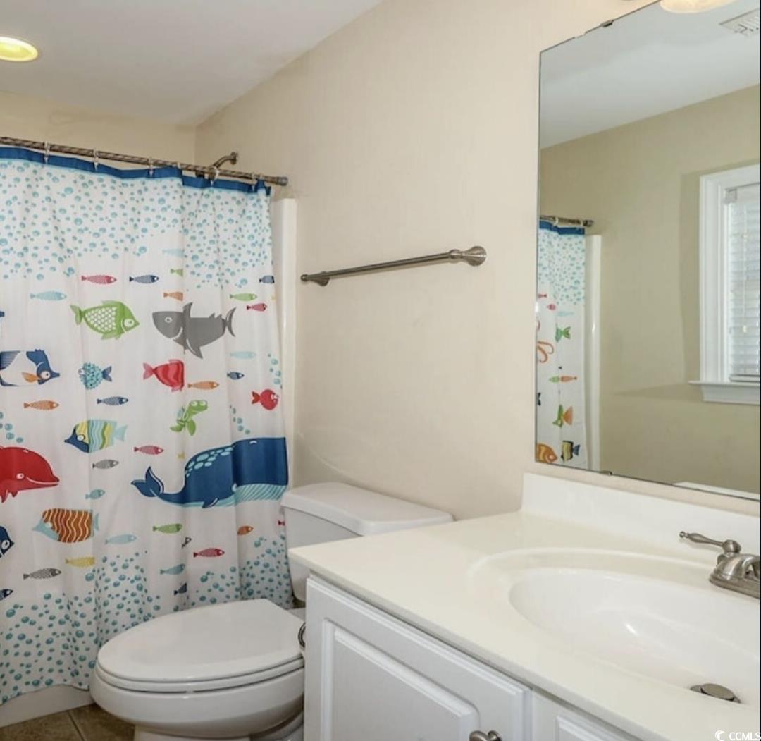511 Caribbean Way Myrtle Beach, SC 29577 - Photo 13 of 17 Bathroom with toilet, walk in shower, and vanity