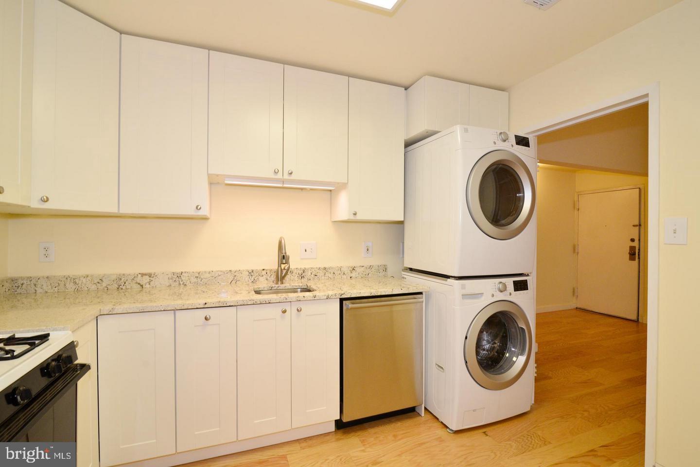 11803 Breton Court, Unit 32C Reston, VA 20191 - Photo 11 of 23 a utility room with sink dryer and washer