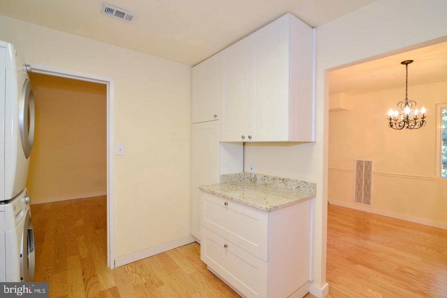 11803 Breton Court, Unit 32C Reston, VA 20191 - Photo 13 of 23 a bathroom with a granite countertop sink and a mirror