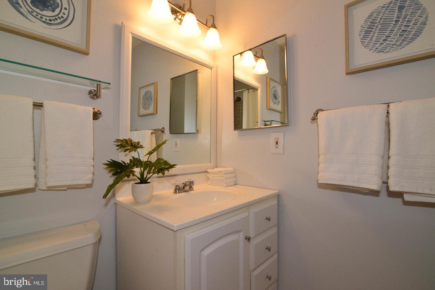 11803 Breton Court, Unit 32C Reston, VA 20191 - Photo 19 of 23 a bathroom with a sink and a mirror