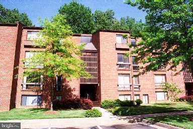 11803 Breton Court, Unit 32C Reston, VA 20191 - Photo 2 of 23 front view of a building with a yard