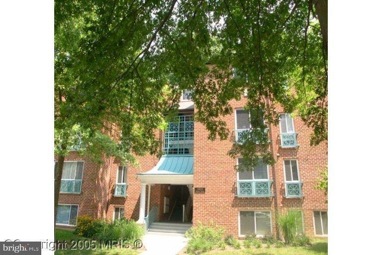 11803 Breton Court, Unit 32C Reston, VA 20191 - Photo 23 of 23 a view of house with yard