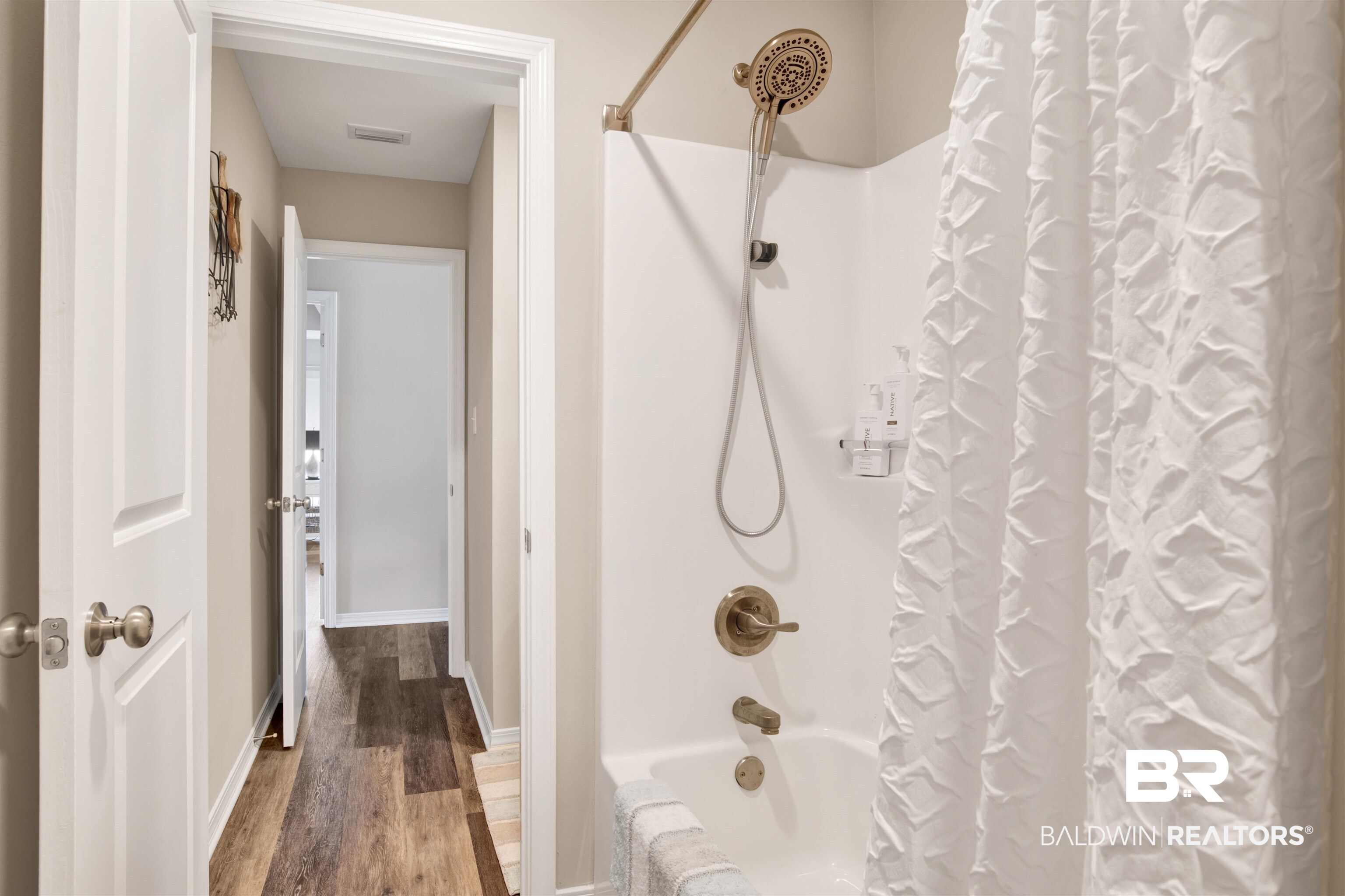 3097 Ingrid Lane Foley, AL 36535 - Photo 26 of 38 Bathroom featuring wood-type flooring and shower / bath combo