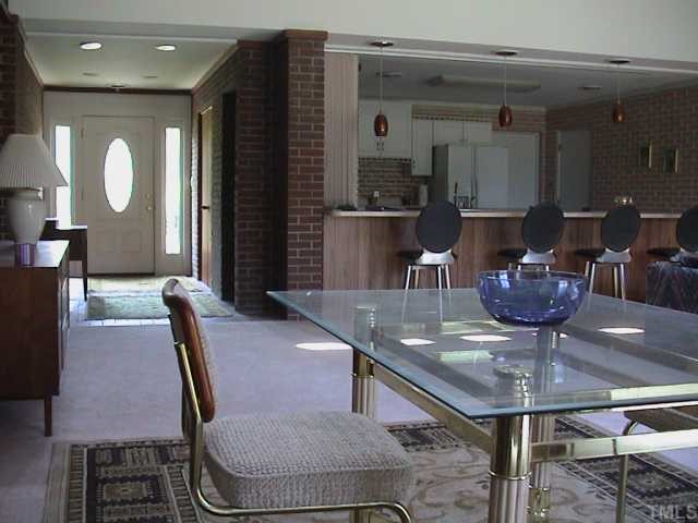 5405 Castlebrook Drive Raleigh, NC 27604 - Photo 4 of 12 a view of a dining room with furniture
