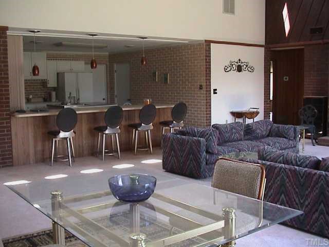5405 Castlebrook Drive Raleigh, NC 27604 - Photo 5 of 12 a living room with lots of furniture and a view of kitchen