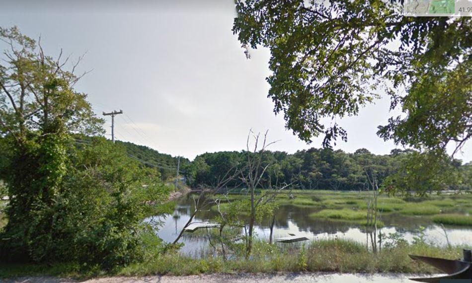 1 Mill Pond Road Truro, MA 02666 - Photo 3 of 5 a view of lake with green space
