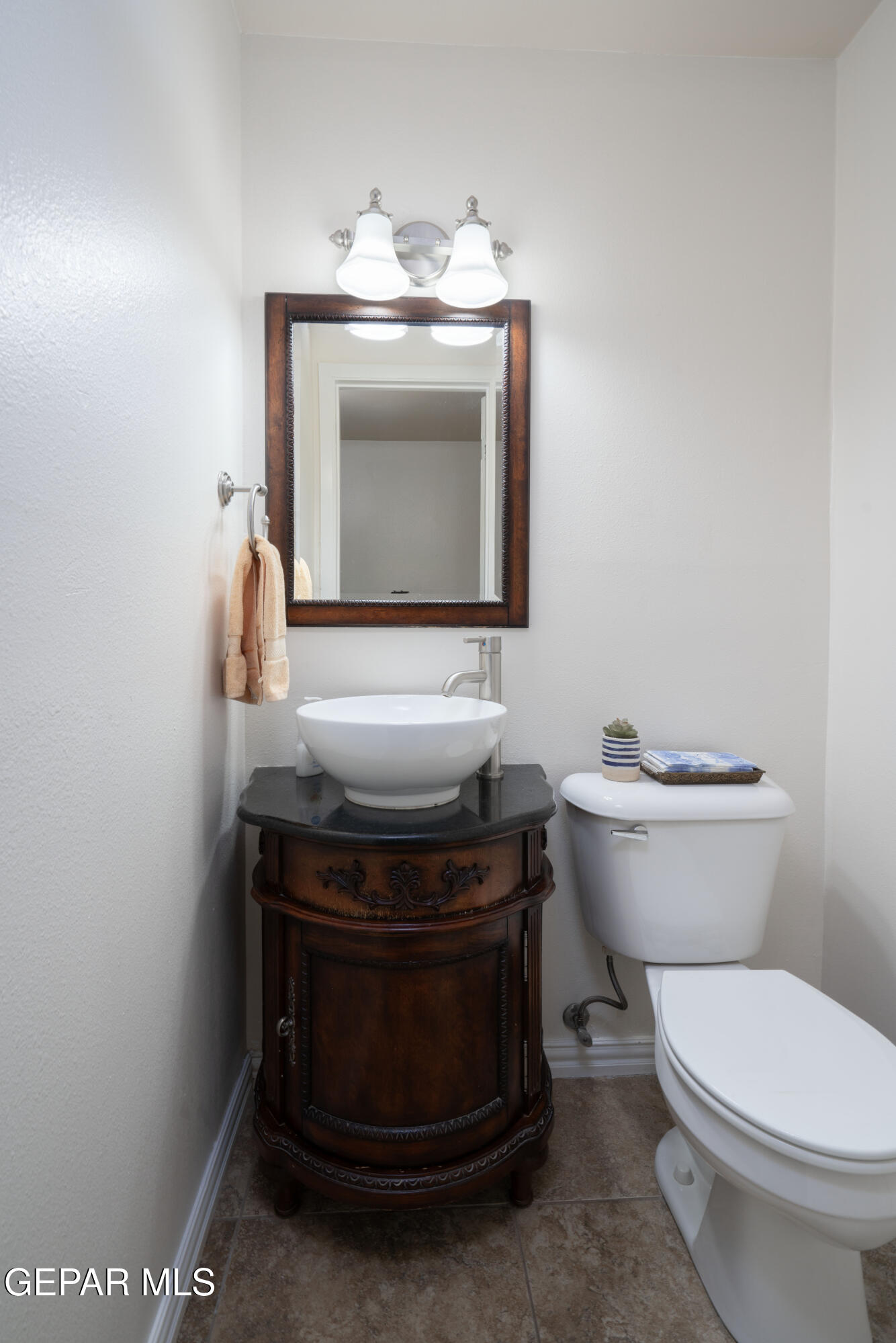 404 Butte Circle El Paso, TX 79902 - Photo 19 of 24 a bathroom with a toilet and a sink