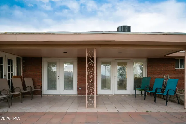 a view of living room with furniture and a rug