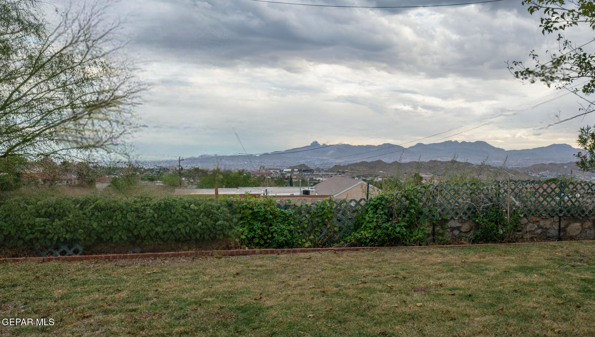 404 Butte Circle El Paso, TX 79902 - Photo 22 of 24 a view of a lake in middle of forest