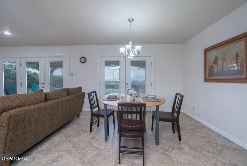 404 Butte Circle El Paso, TX 79902 - Photo 6 of 24 a view of a dining room with furniture and chandelier