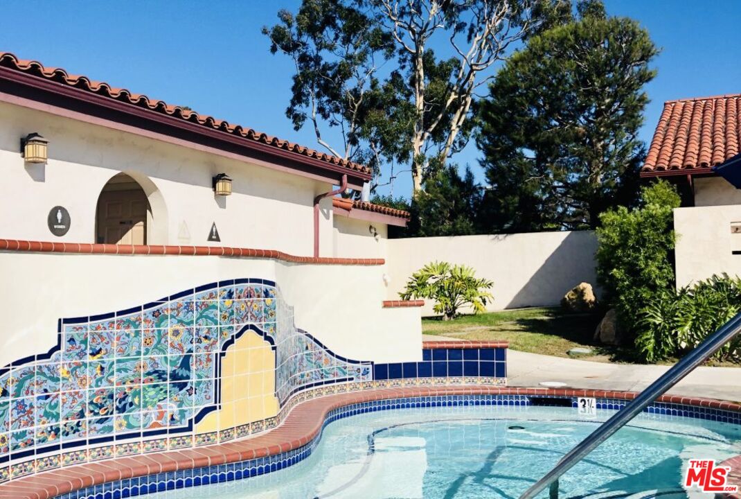 29500 Heathercliff Road, Unit 5 Malibu, CA 90265 - Photo 12 of 17 a front view of a house with a garden