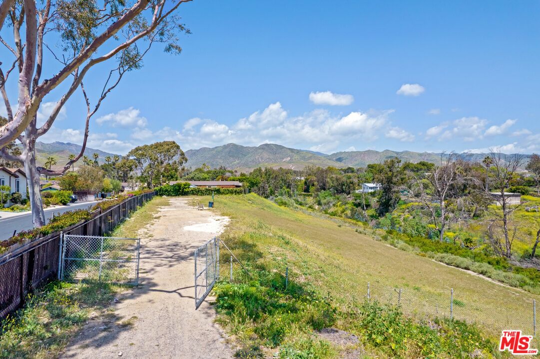 29500 Heathercliff Road, Unit 5 Malibu, CA 90265 - Photo 14 of 17 a view of a lake with a yard