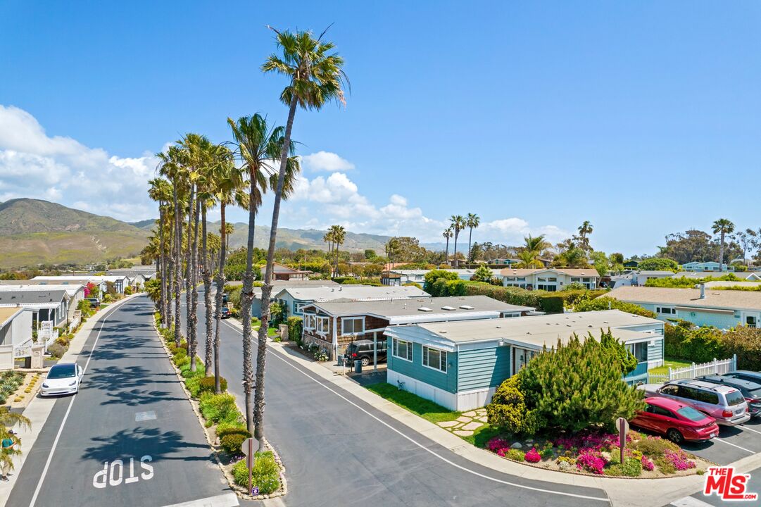 29500 Heathercliff Road, Unit 5 Malibu, CA 90265 - Photo 2 of 17 a view of a lake with a building in the background