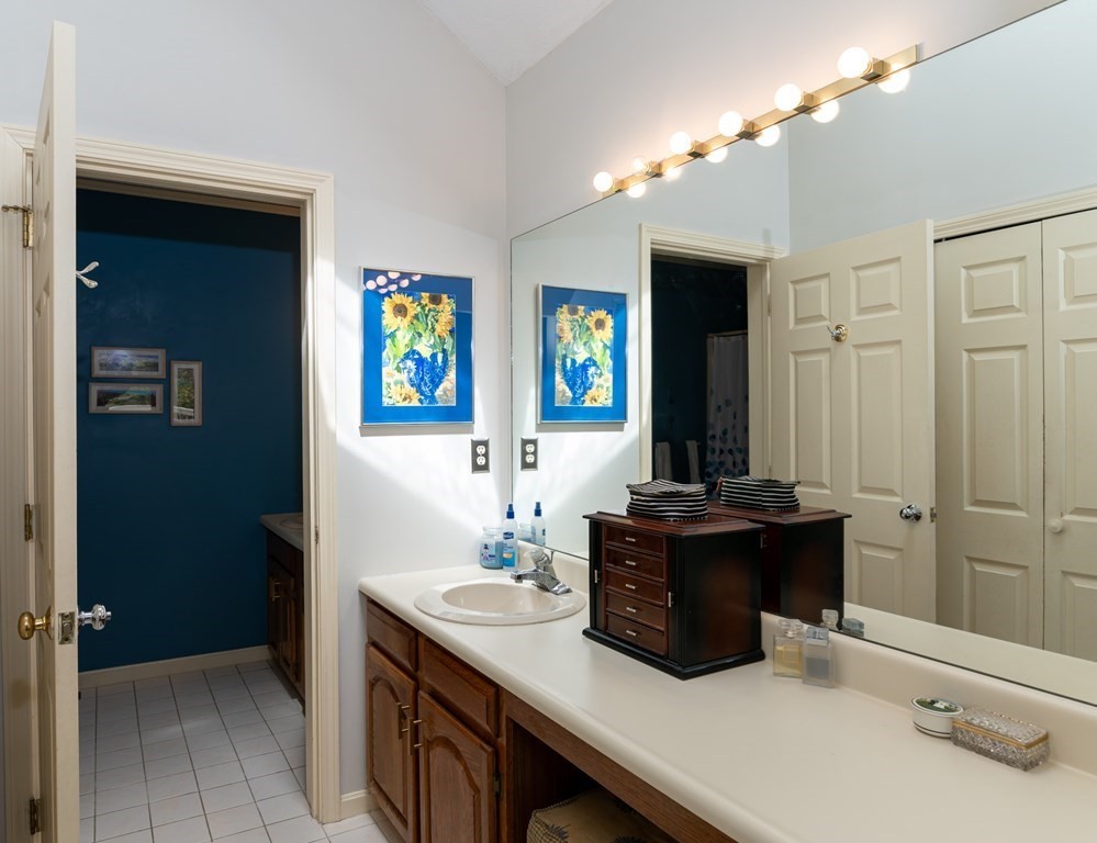 12 Wynridge Road, Unit 12 Windham, NH 03087 - Photo 20 of 40 a kitchen with a sink and a mirror