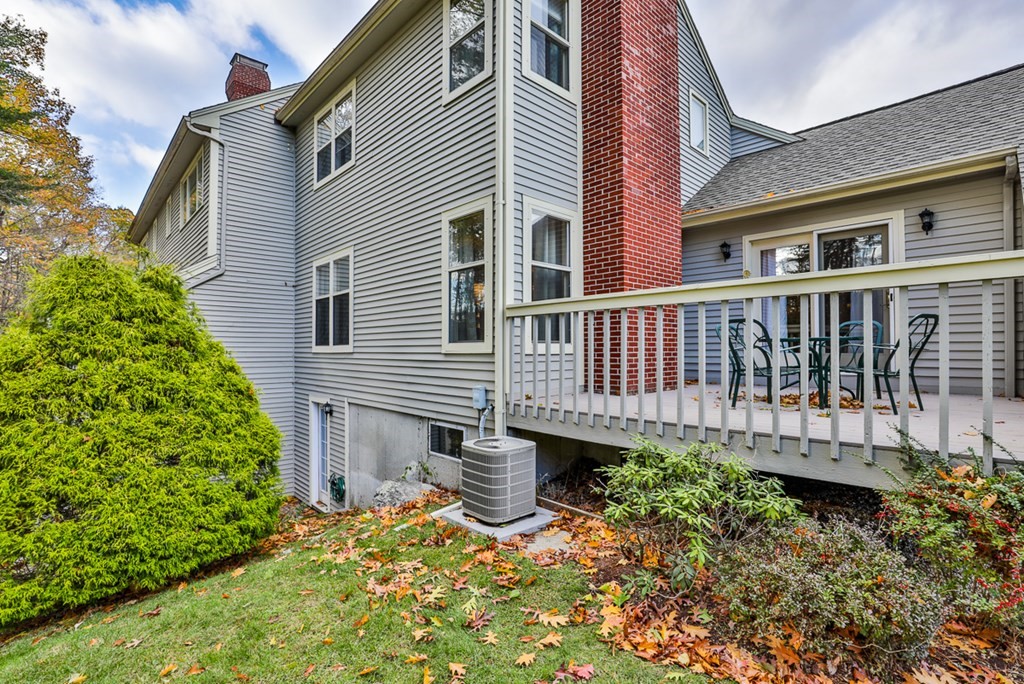 12 Wynridge Road, Unit 12 Windham, NH 03087 - Photo 6 of 40 a view of a house with wooden fence