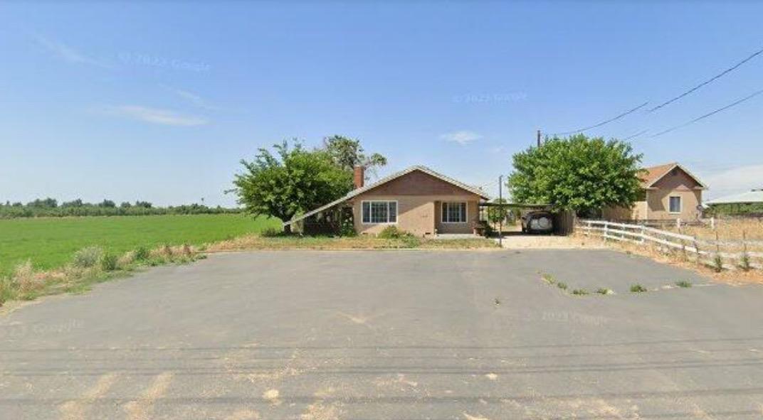 11637 East Keyes Road Denair, CA 95316 - Photo 1 of 1 a front view of a house with a yard and garage