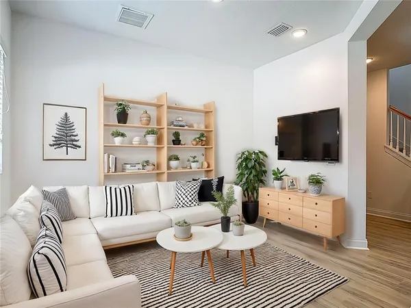 a view of a room with wooden floor