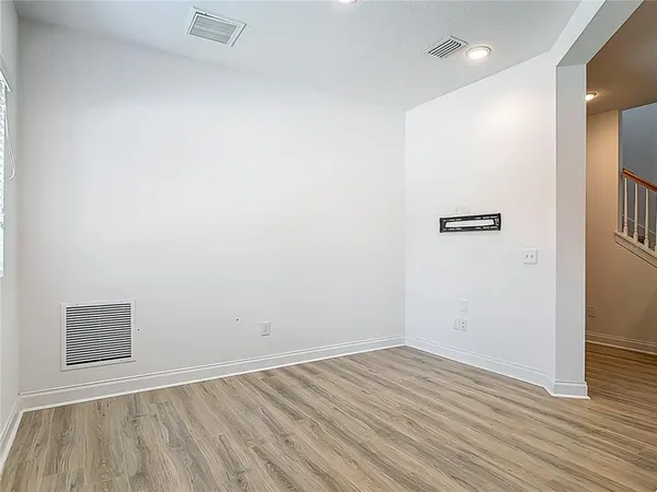 a view of a kitchen with a sink and a refrigerator