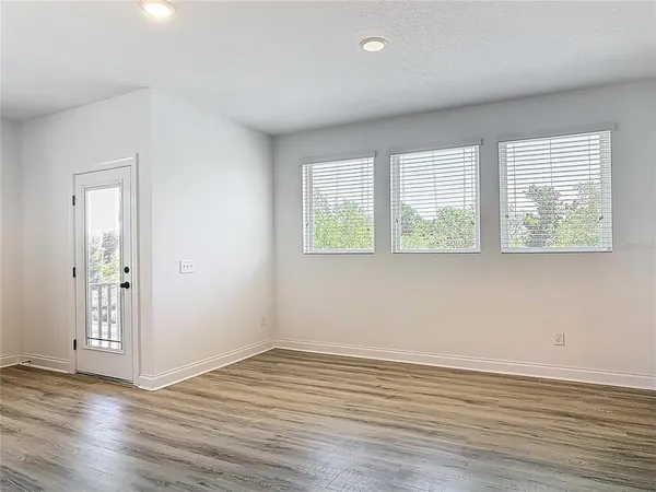a kitchen with granite countertop a sink and cabinets