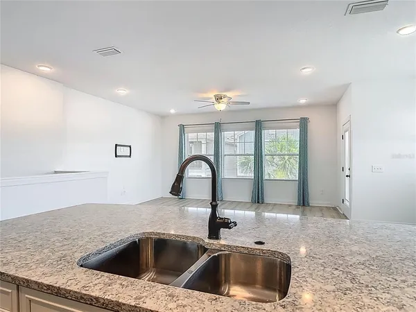 a bathroom with a bathtub and a window