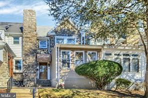 1217 North 65th Street, Unit 1 Philadelphia, PA 19151 - Photo 1 of 9 a front view of a house with garden