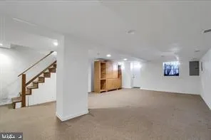 a view of an empty room with stairs