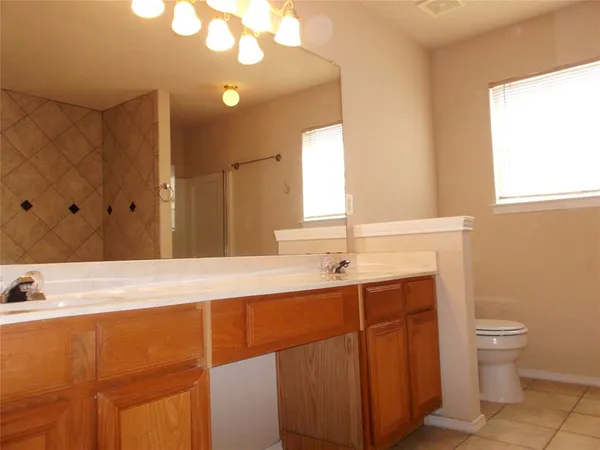 a bathroom with a bathtub and a toilet