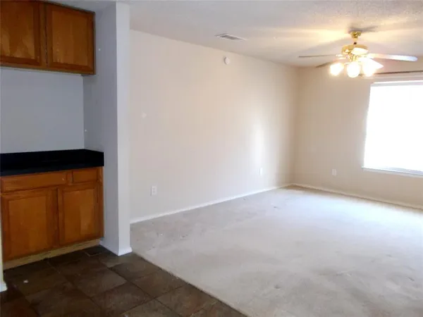 a kitchen with granite countertop a stove a sink and a granite counter tops