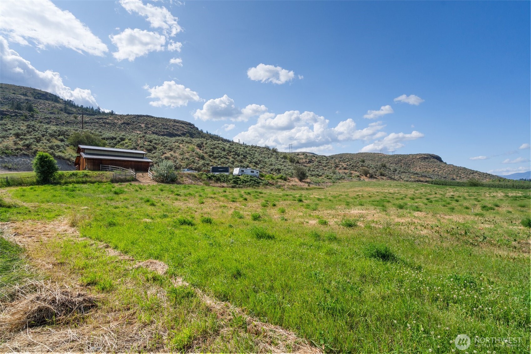 36 Rooster Flts Road Oroville, WA 98844 - Photo 5 of 6 a view of a big yard with table and chairs